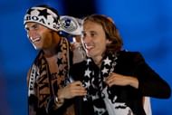 MADRID, SPAIN - MAY 25: Gareth Bale (L) of Real Madrid CF tocuhes his teammates head Luka Modric (L) during the celebration of their victory on the UEFA Champions League Final match against Club Atletico de Madrid at Cibeles square on the early morning of May, 25, 2014 in Madrid, Spain. Real Madrid CF achieves their 10th European Cup at Lisbon 12 years later.  (Photo by Gonzalo Arroyo Moreno/Getty Images)